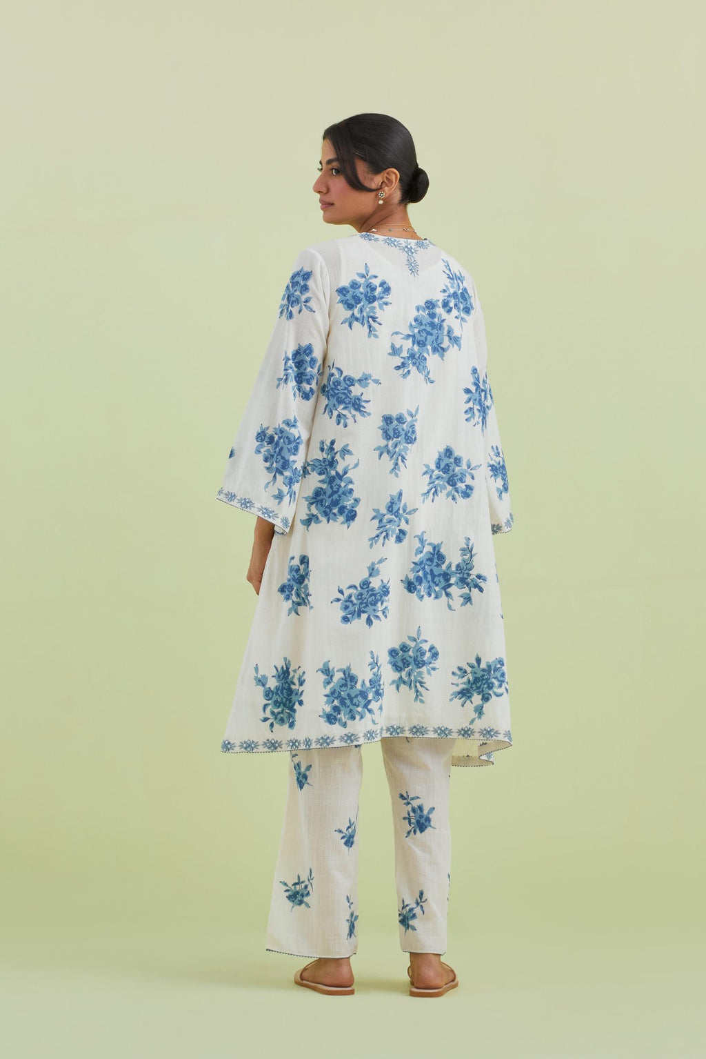 Blue and off-white cotton hand-block printed A-line short kurta set with round neck and asymmetric hem.