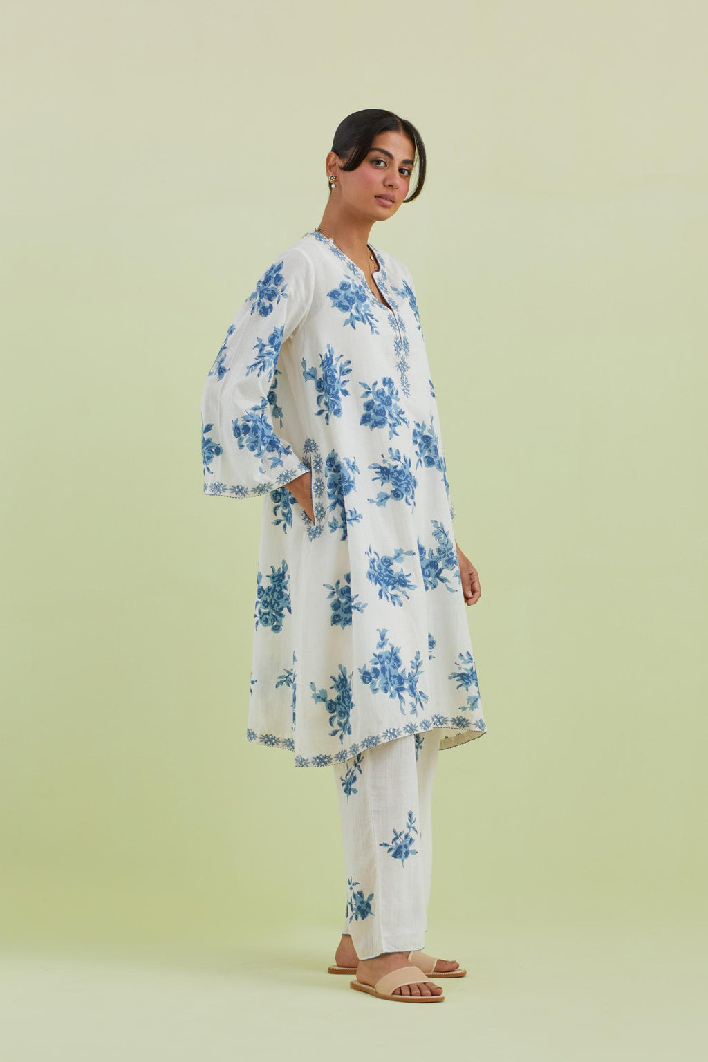 Blue and off-white cotton hand-block printed A-line short kurta set with round neck and asymmetric hem.