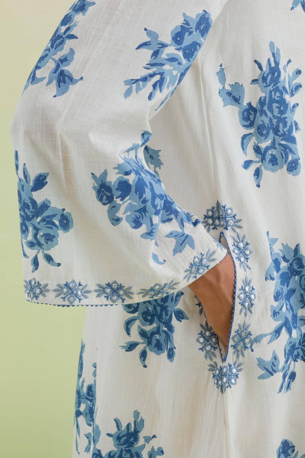 Blue and off-white cotton hand-block printed A-line short kurta set with round neck and asymmetric hem.