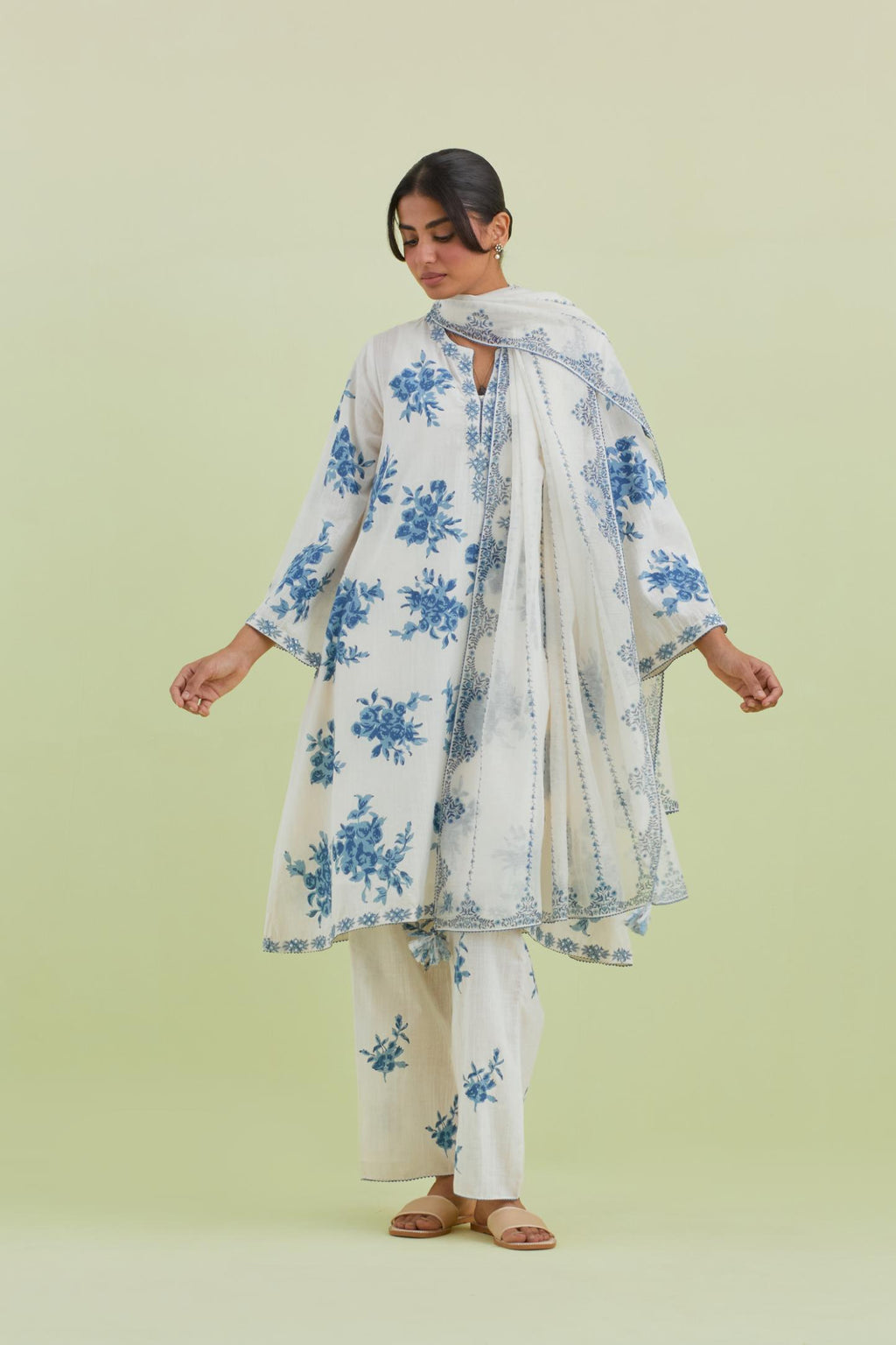 Blue and off-white cotton hand-block printed A-line short kurta set with round neck and asymmetric hem.