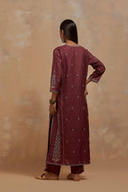 Deep berry silk hand block printed kalidar straight kurta set, highlighted with multi colored silk thread embroidery.