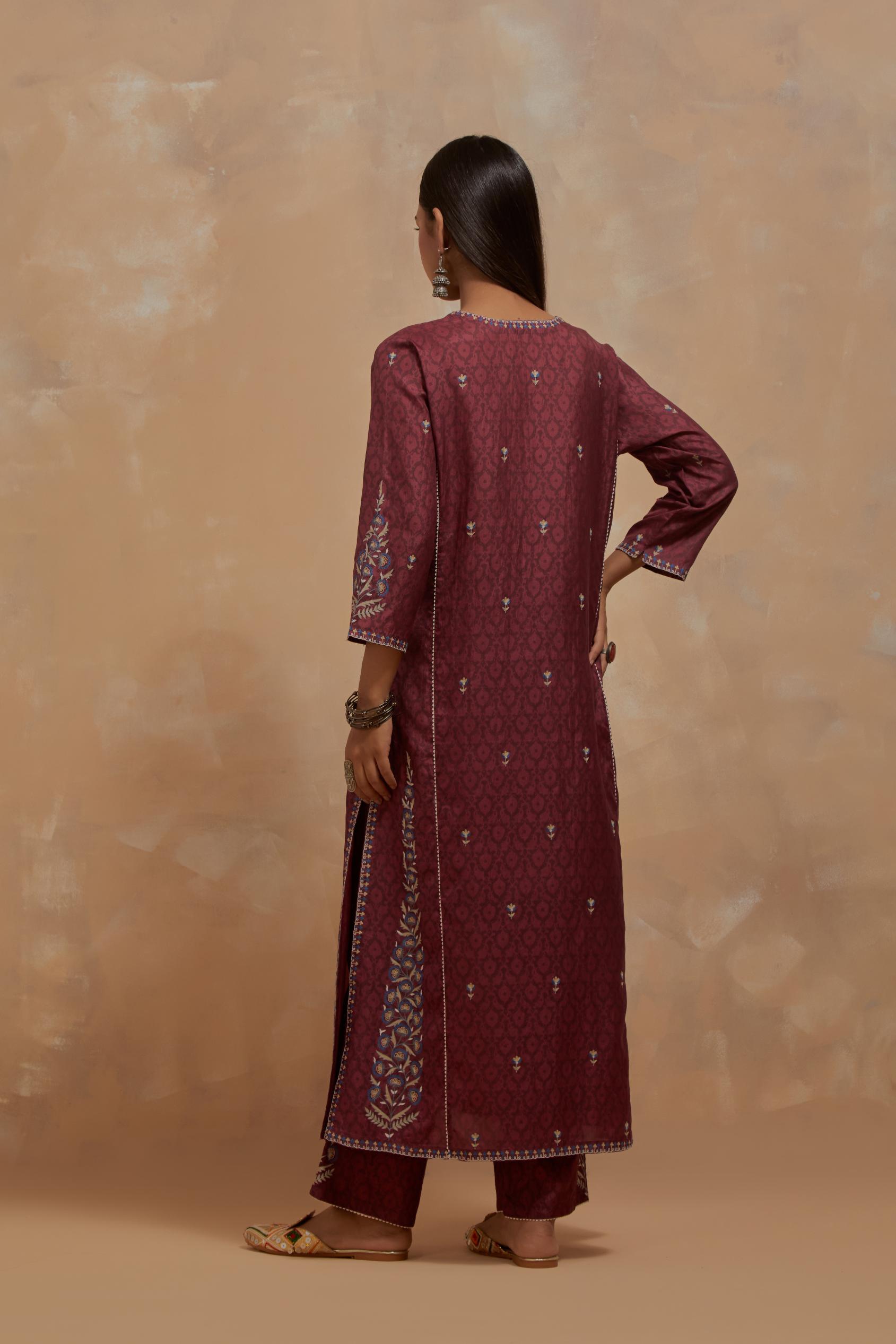 Deep berry silk hand block printed kalidar straight kurta set, highlighted with multi colored silk thread embroidery.