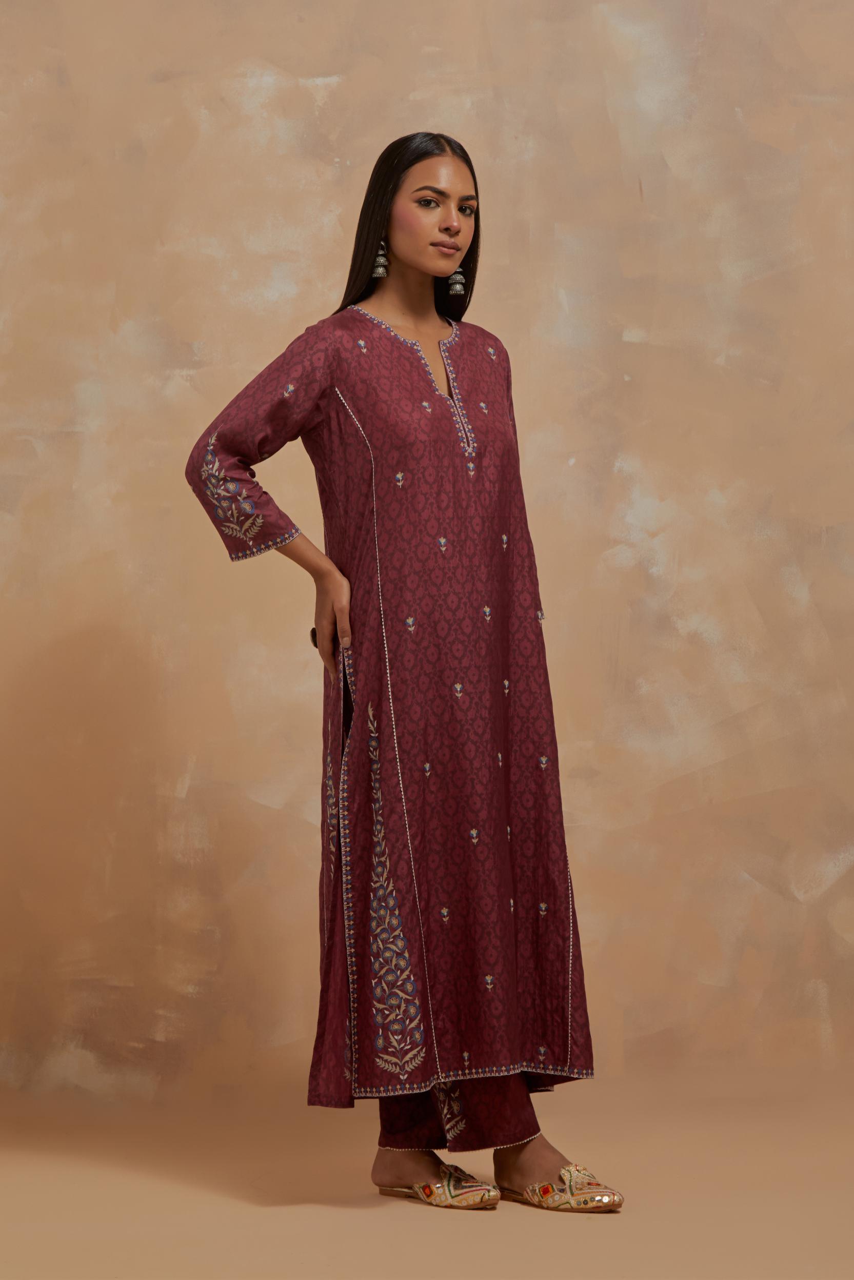 Deep berry silk hand block printed kalidar straight kurta set, highlighted with multi colored silk thread embroidery.