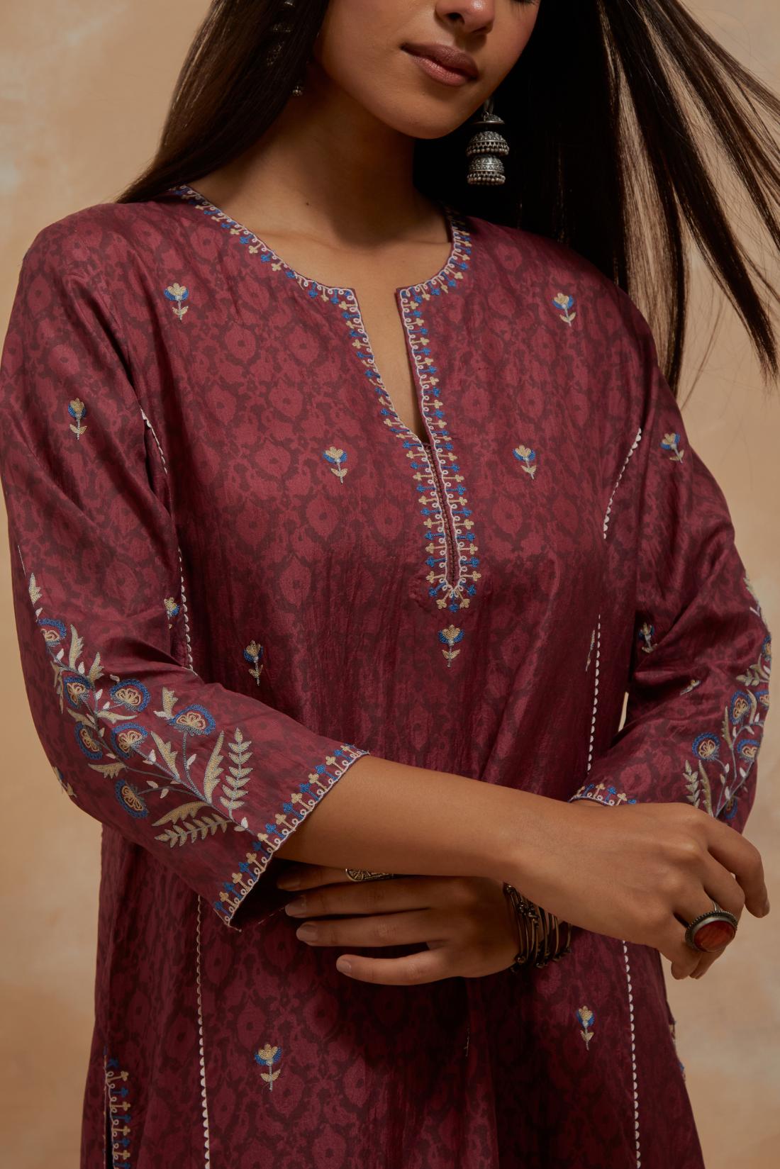 Deep berry silk hand block printed kalidar straight kurta set, highlighted with multi colored silk thread embroidery.