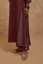 Deep berry silk hand block printed kalidar straight kurta set, highlighted with multi colored silk thread embroidery.