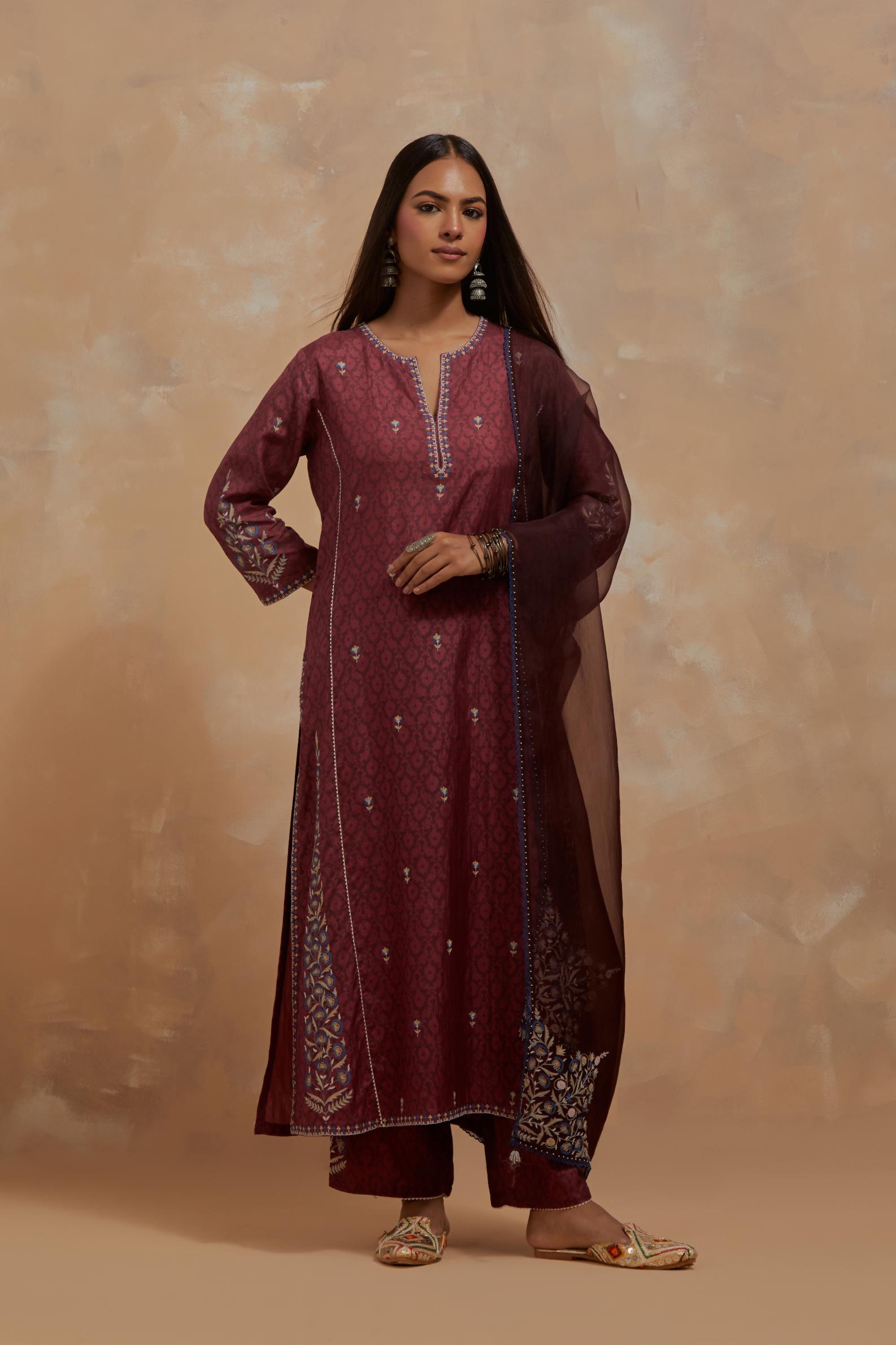 Deep berry silk hand block printed kalidar straight kurta set, highlighted with multi colored silk thread embroidery.