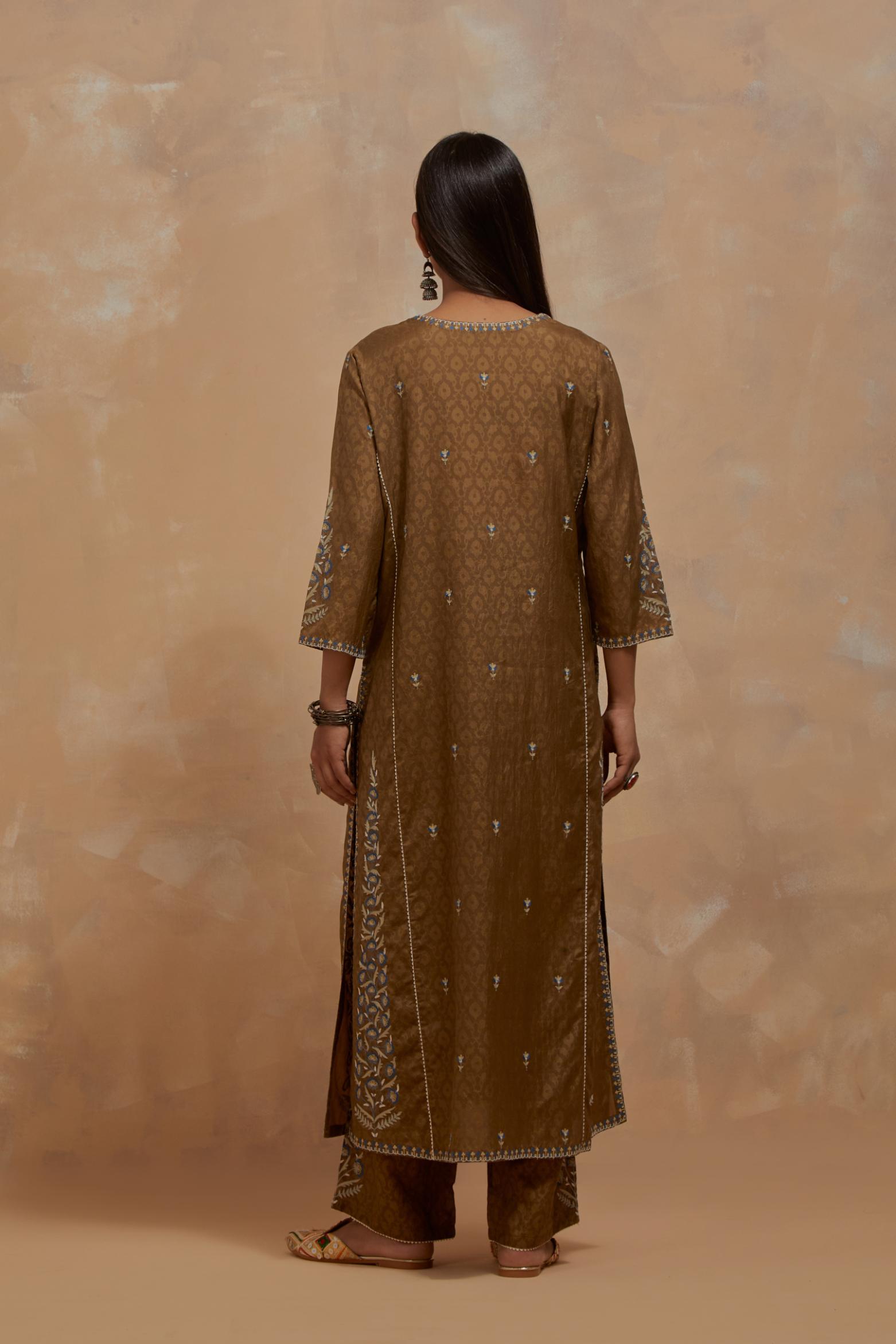 Olive green silk hand block printed kalidar straight kurta set, highlighted with multi colored silk thread embroidery.