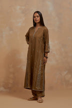 Olive green silk hand block printed kalidar straight kurta set, highlighted with multi colored silk thread embroidery.