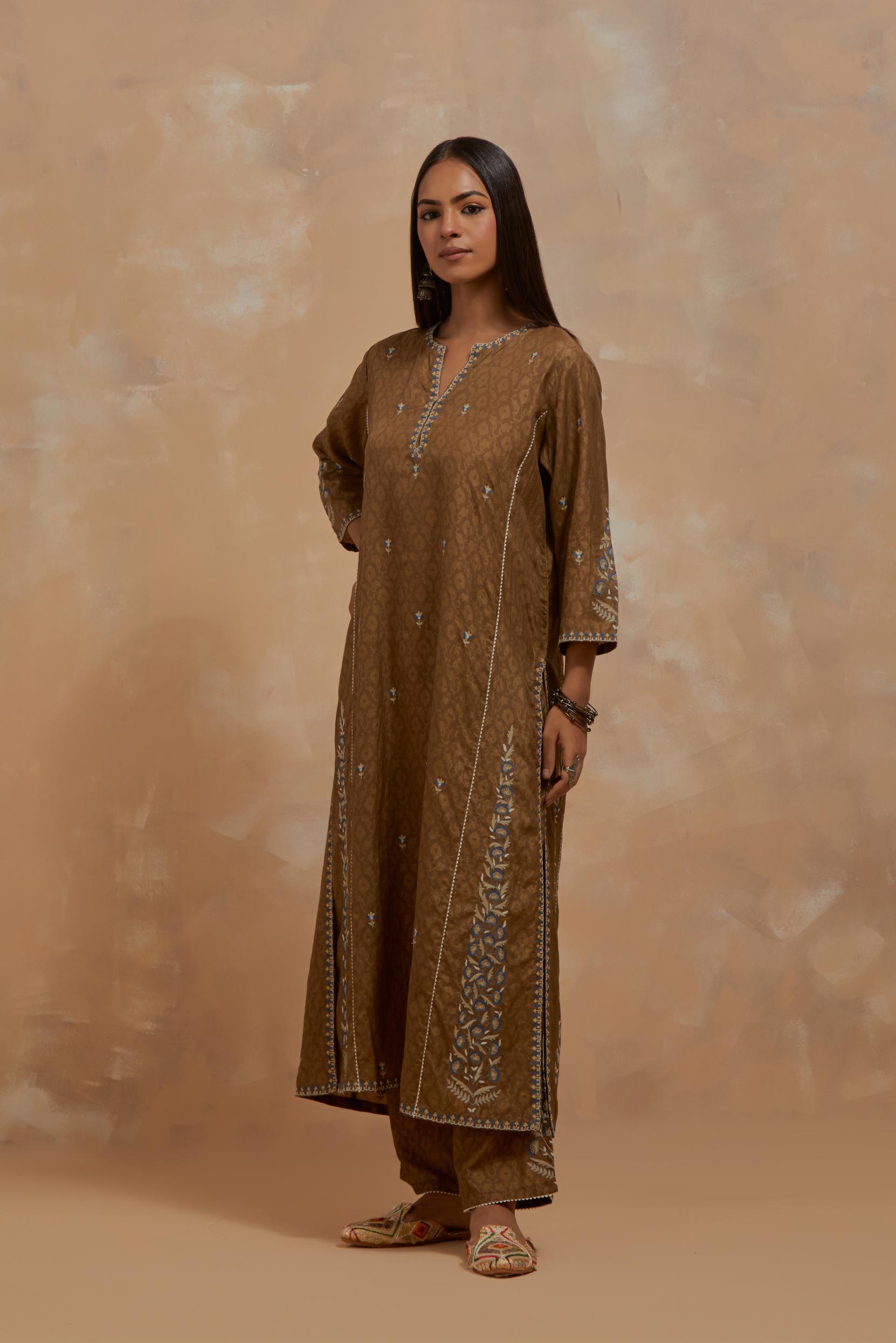 Olive green silk hand block printed kalidar straight kurta set, highlighted with multi colored silk thread embroidery.