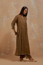 Olive green silk hand block printed kalidar straight kurta set, highlighted with multi colored silk thread embroidery.