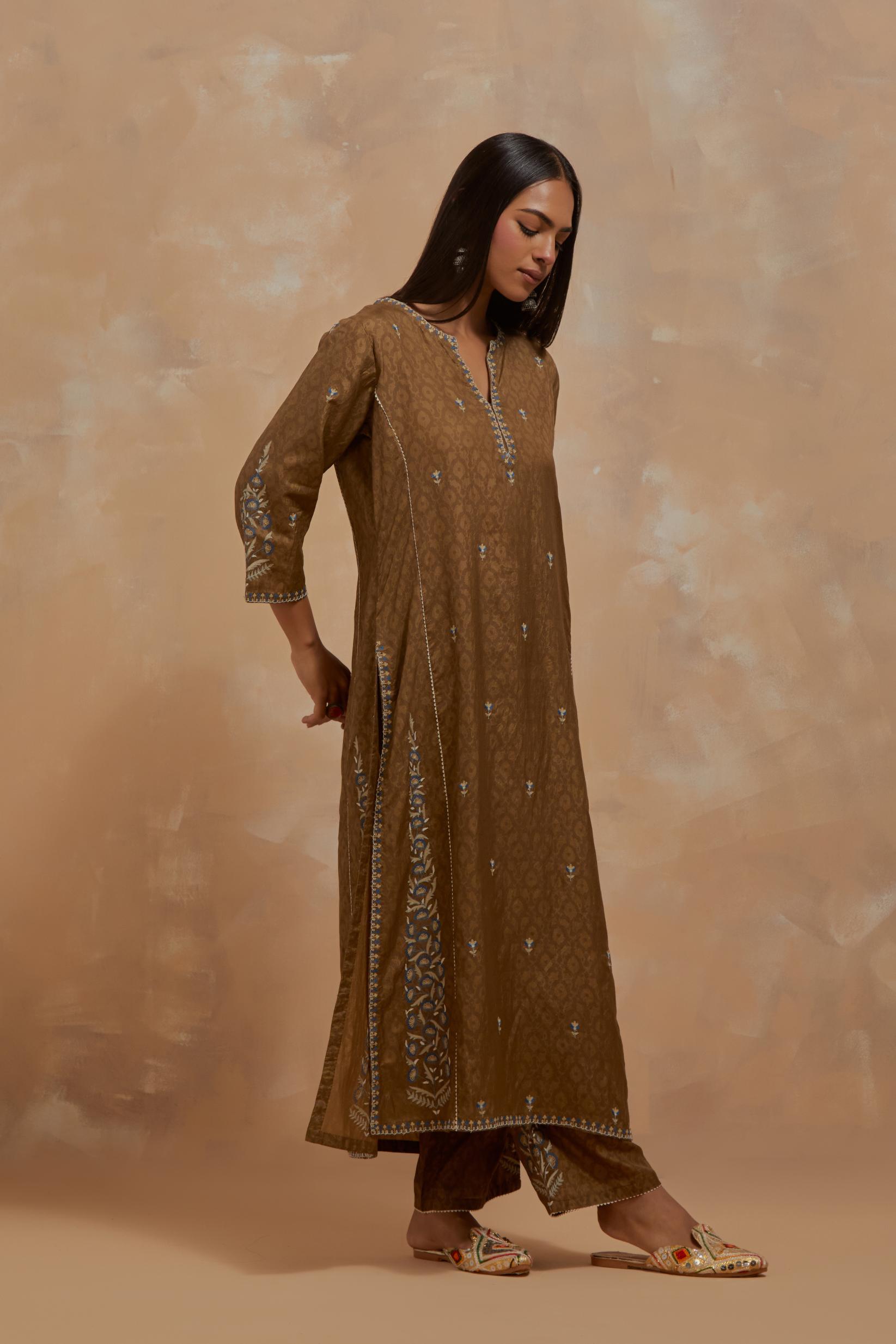 Olive green silk hand block printed kalidar straight kurta set, highlighted with multi colored silk thread embroidery.