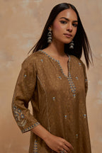 Olive green silk hand block printed kalidar straight kurta set, highlighted with multi colored silk thread embroidery.