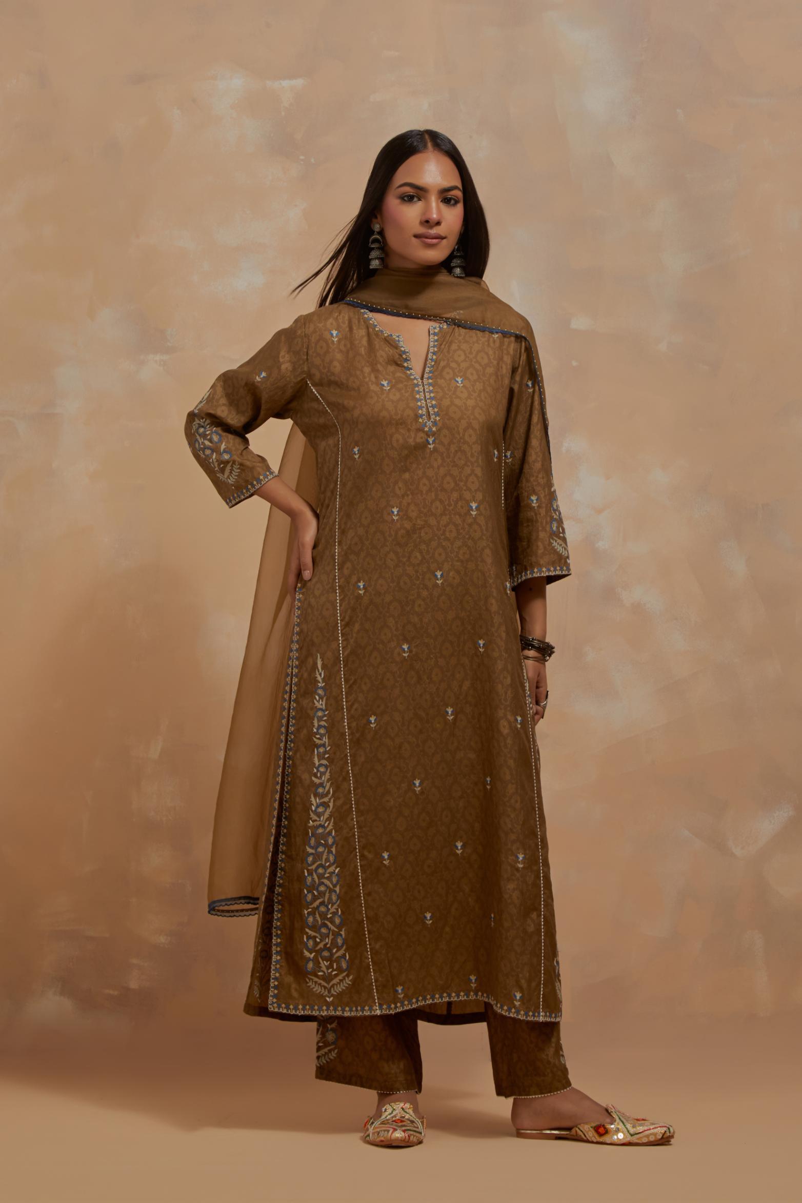 Olive green silk hand block printed kalidar straight kurta set, highlighted with multi colored silk thread embroidery.