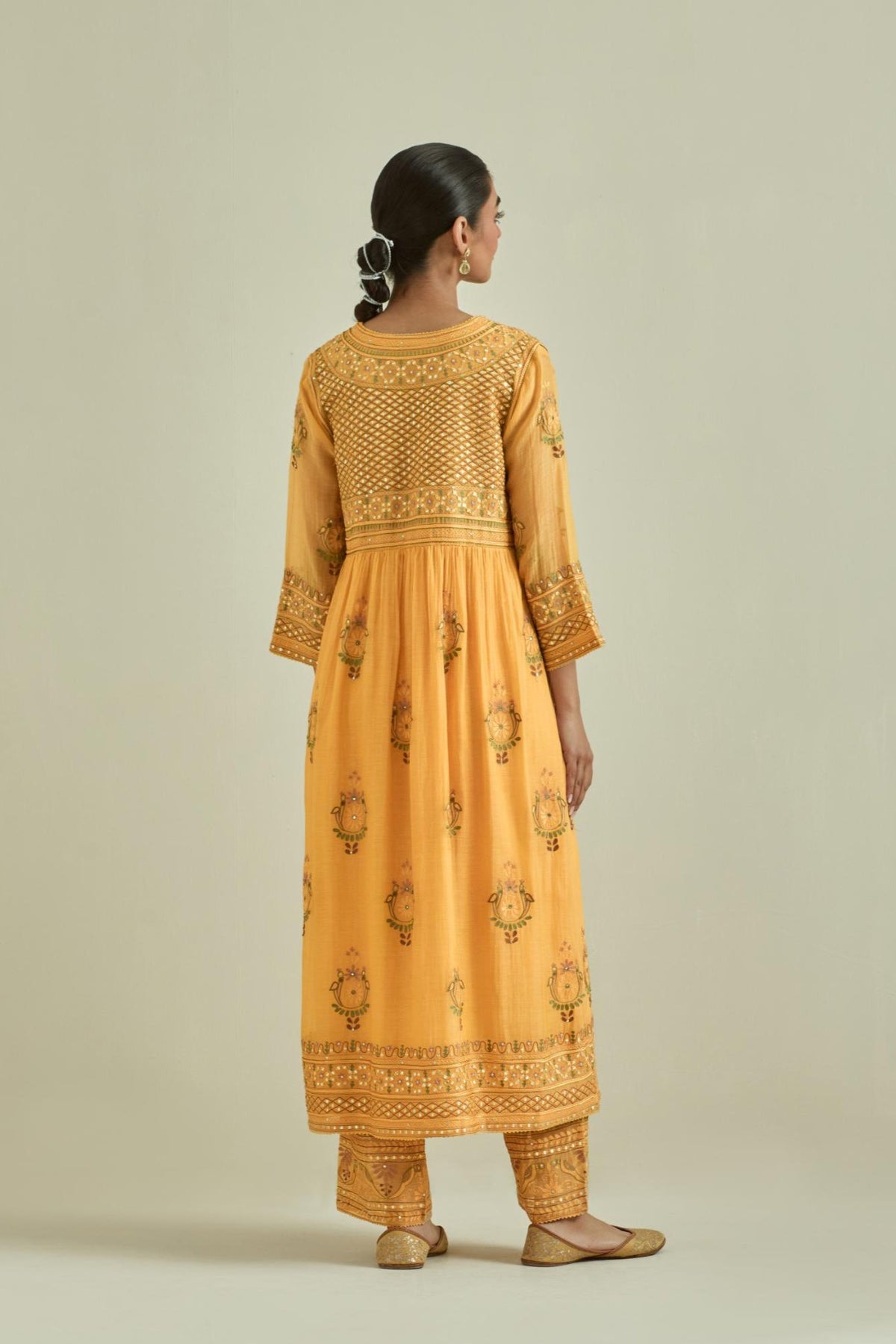 Yellow cotton chanderi embroidered kurta dress set with V neck, yoke and fine gathers at empire line.