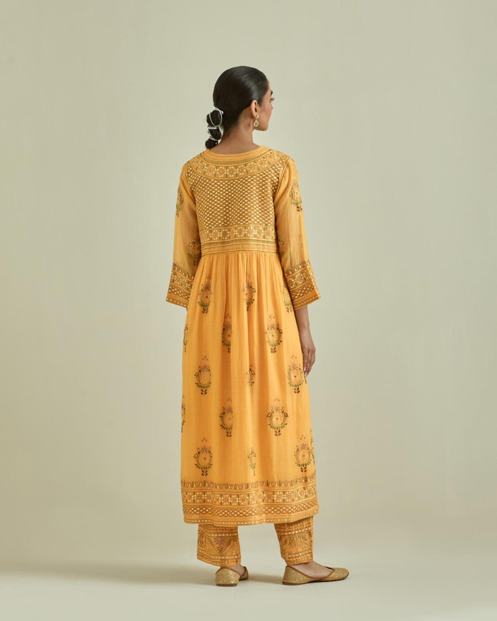 Yellow cotton chanderi embroidered kurta dress set with V neck, yoke and fine gathers at empire line.