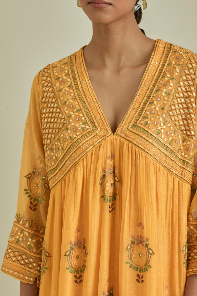 Yellow cotton chanderi embroidered kurta dress set with V neck, yoke and fine gathers at empire line.