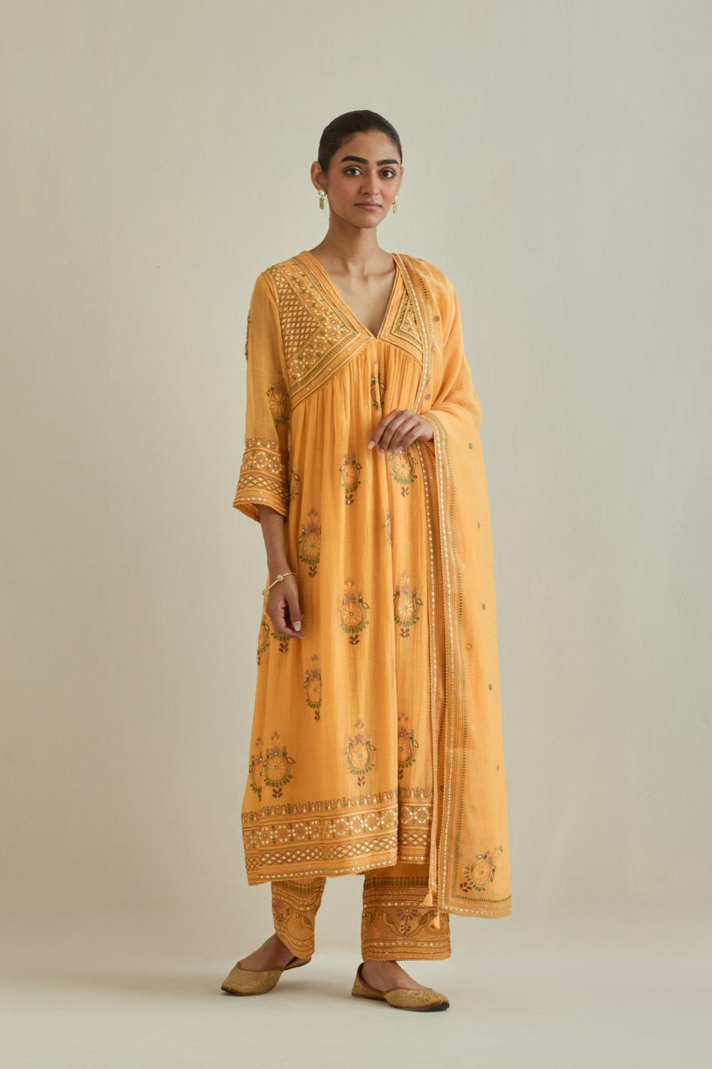 Yellow cotton chanderi embroidered kurta dress set with V neck, yoke and fine gathers at empire line.