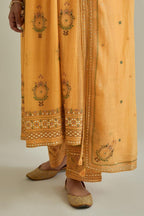 Yellow cotton chanderi embroidered kurta dress set with V neck, yoke and fine gathers at empire line.