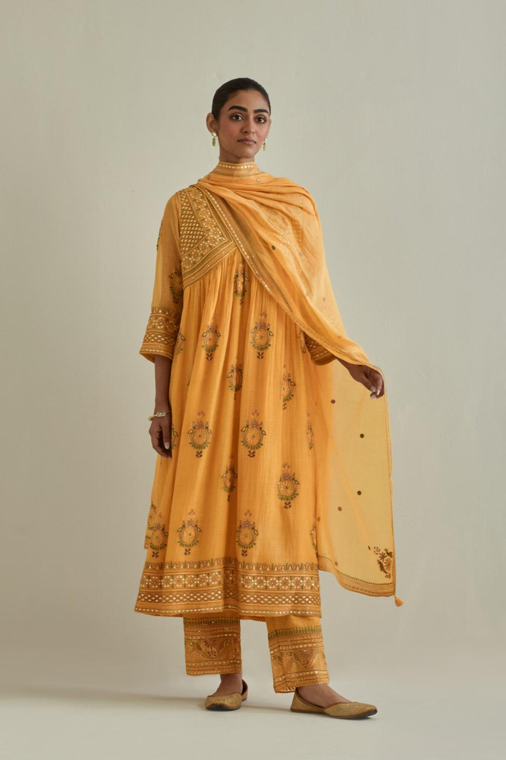 Yellow cotton chanderi embroidered kurta dress set with V neck, yoke and fine gathers at empire line.