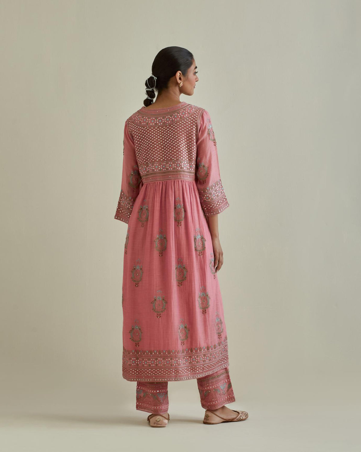 Pink cotton chanderi embroidered kurta dress set with V neck, yoke and fine gathers at empire line.