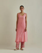 Pink cotton chanderi straight kurta set with yoke and side panels. It has allover patchwork and silk thread embroidery, highlighted with mirror, sequins, tassels and braids.