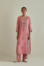 Pink cotton chanderi straight kurta set with yoke and side panels. It has allover patchwork and silk thread embroidery, highlighted with mirror, sequins, tassels and braids.