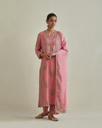 Pink cotton chanderi straight kurta set with yoke and side panels. It has allover patchwork and silk thread embroidery, highlighted with mirror, sequins, tassels and braids.