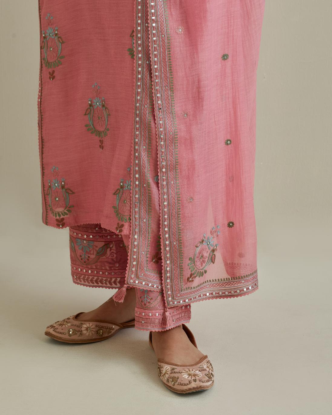 Pink cotton chanderi straight kurta set with yoke and side panels. It has allover patchwork and silk thread embroidery, highlighted with mirror, sequins, tassels and braids.