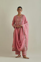 Pink cotton chanderi straight kurta set with yoke and side panels. It has allover patchwork and silk thread embroidery, highlighted with mirror, sequins, tassels and braids.