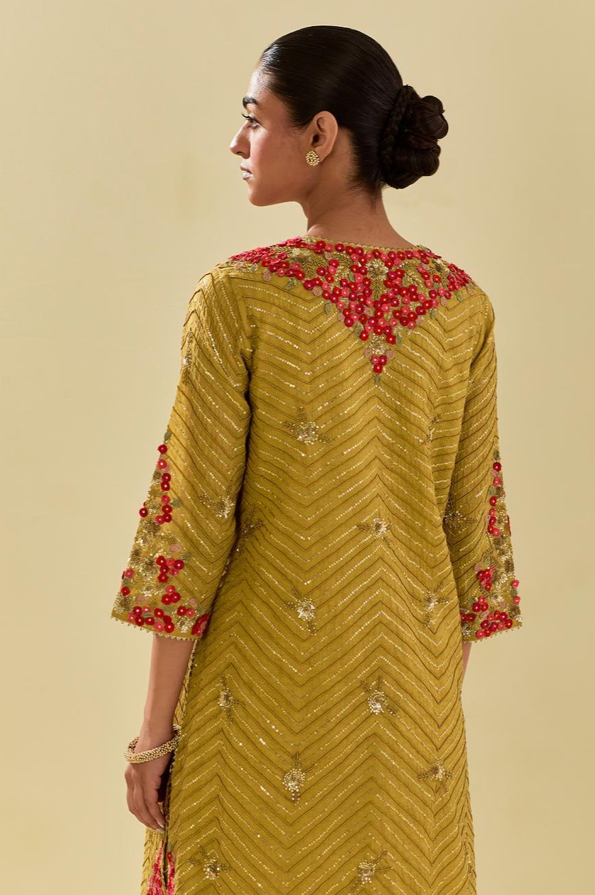 Yellow tissue chanderi straight kurta set with delicate hand cut silk flower embroidery, highlighted with gold sequins and beads.