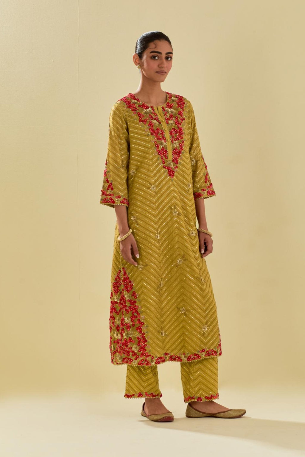 Yellow tissue chanderi straight kurta set with delicate hand cut silk flower embroidery, highlighted with gold sequins and beads.