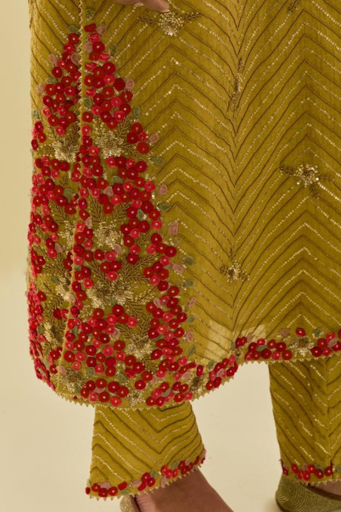 Yellow tissue chanderi straight kurta set with delicate hand cut silk flower embroidery, highlighted with gold sequins and beads.