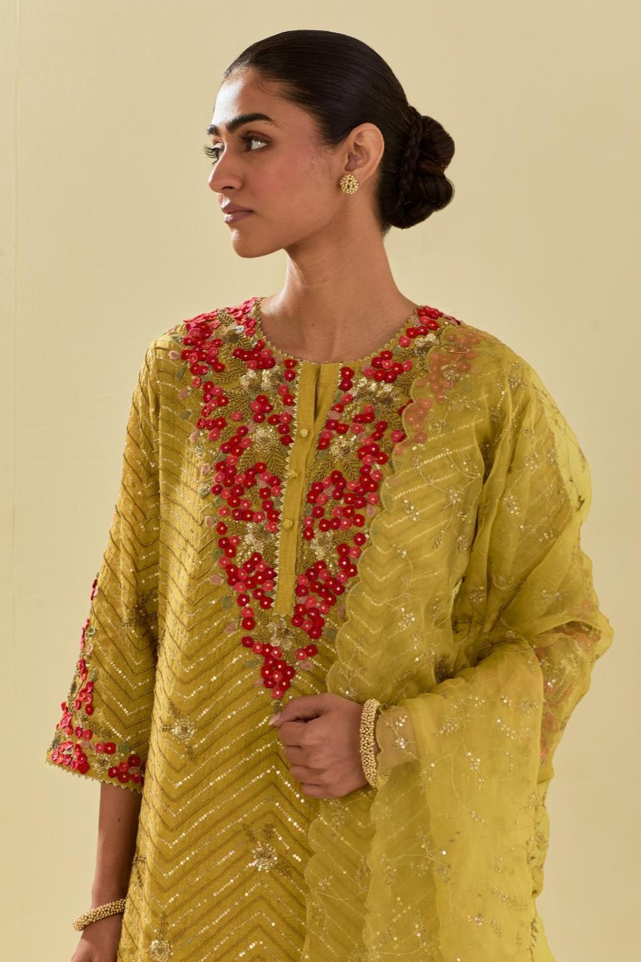 Yellow tissue chanderi straight kurta set with delicate hand cut silk flower embroidery, highlighted with gold sequins and beads.