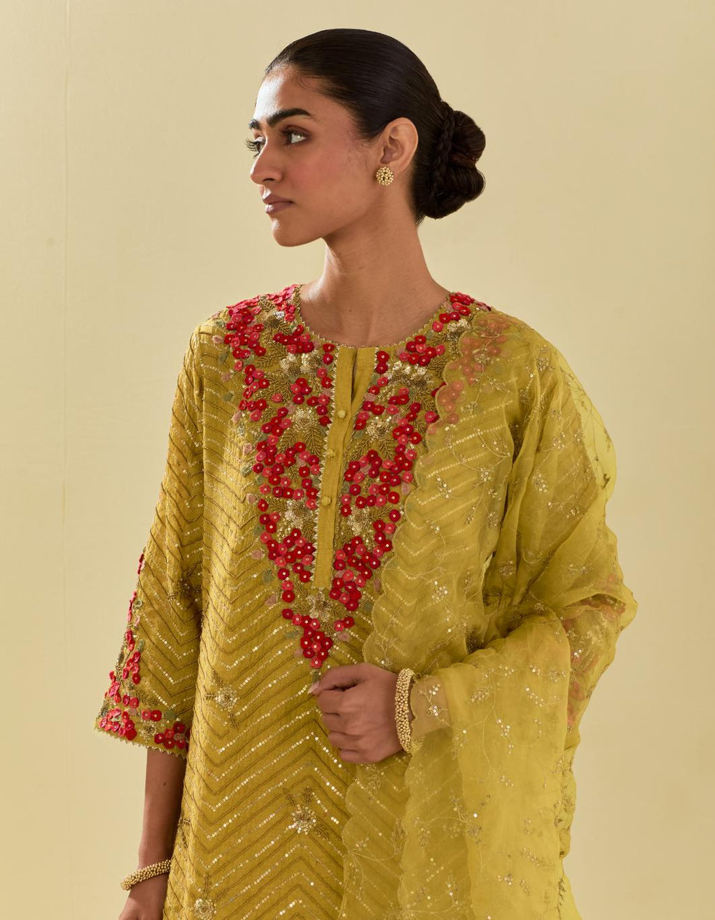 Yellow tissue chanderi straight kurta set with delicate hand cut silk flower embroidery, highlighted with gold sequins and beads.