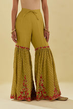 Yellow tissue chanderi farshi with delicate hand cut silk flower embroidery, highlighted with gold sequins and beads.