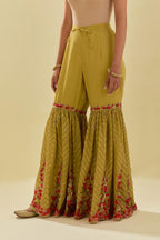 Yellow tissue chanderi farshi with delicate hand cut silk flower embroidery, highlighted with gold sequins and beads.