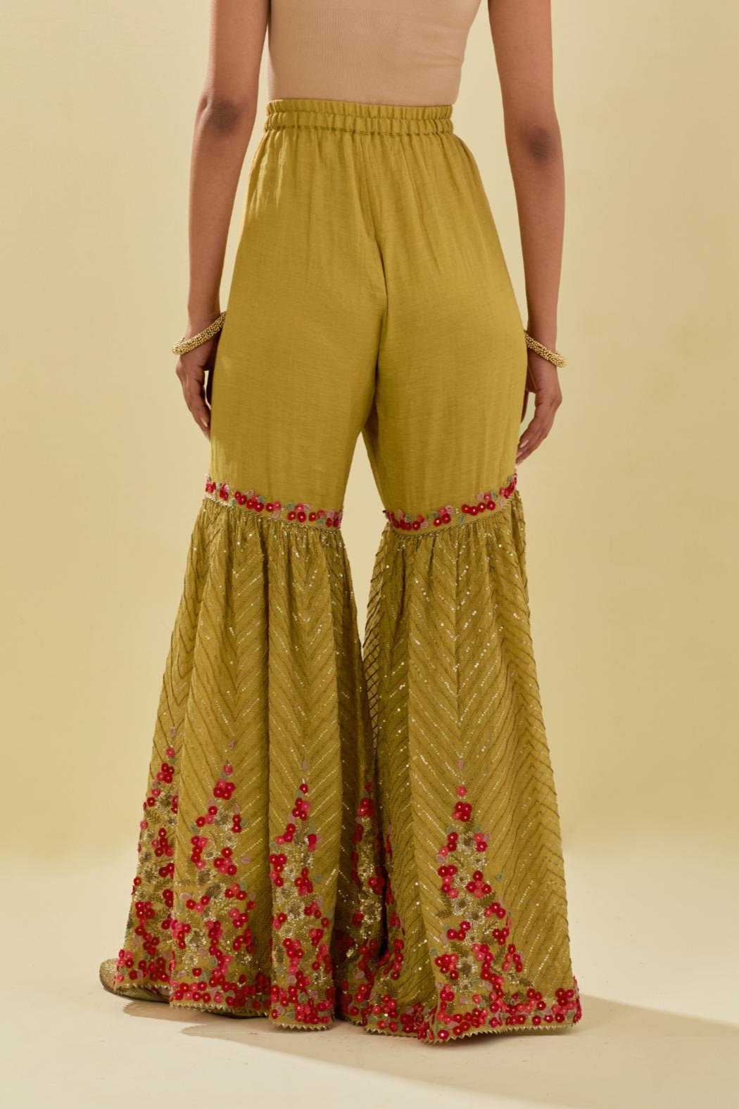 Yellow tissue chanderi farshi with delicate hand cut silk flower embroidery, highlighted with gold sequins and beads.