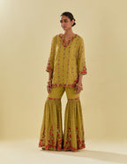 Yellow tissue chanderi short kurta set with round neck and slit in the front and all-over hand cut silk flower embroidery.
