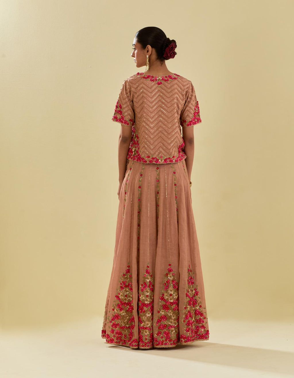 Pink tissue chanderi short top set with delicate hand cut silk flower embroidery, highlighted with gold sequins and beads.