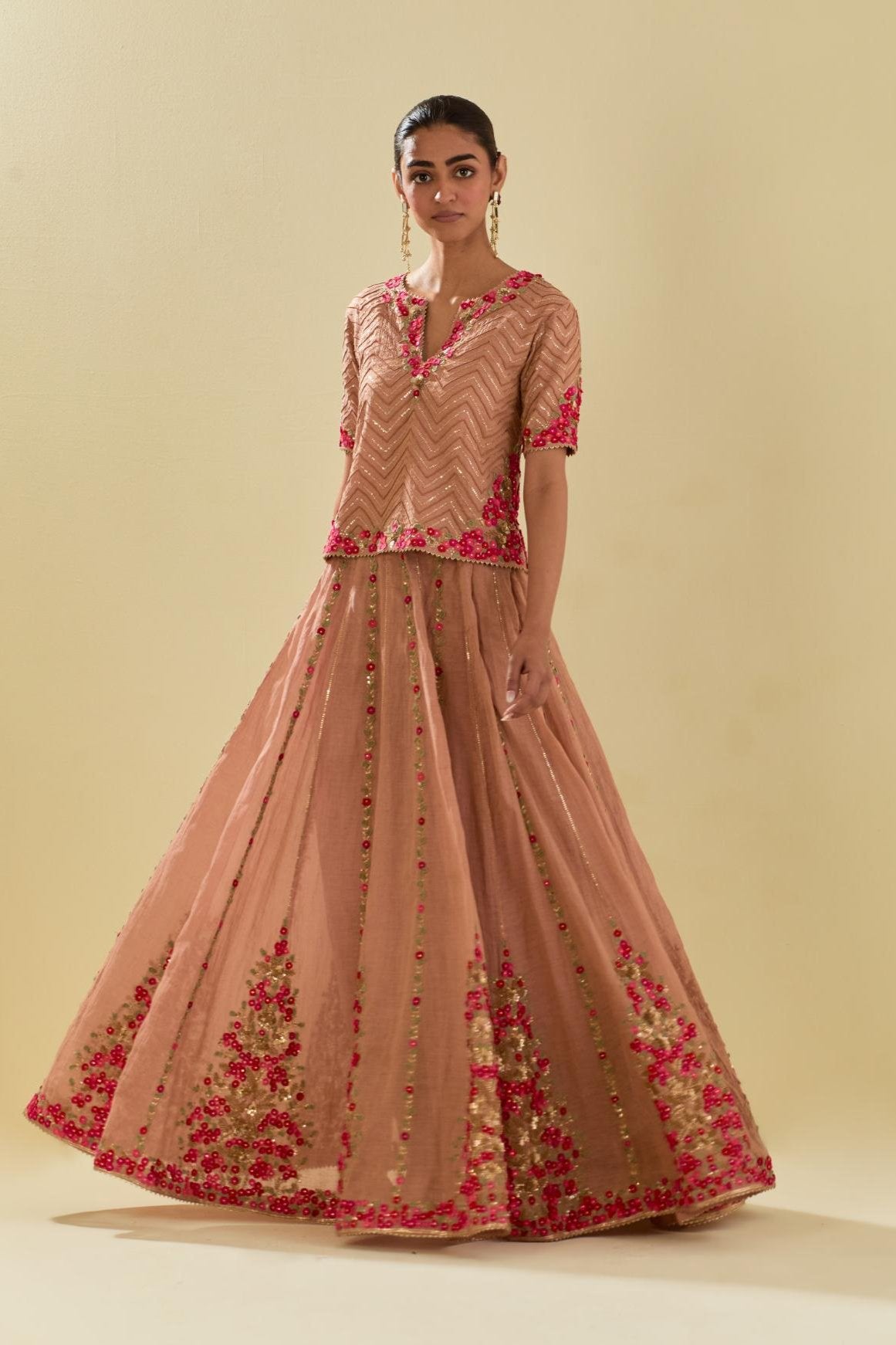 Pink tissue chanderi short top set with delicate hand cut silk flower embroidery, highlighted with gold sequins and beads.