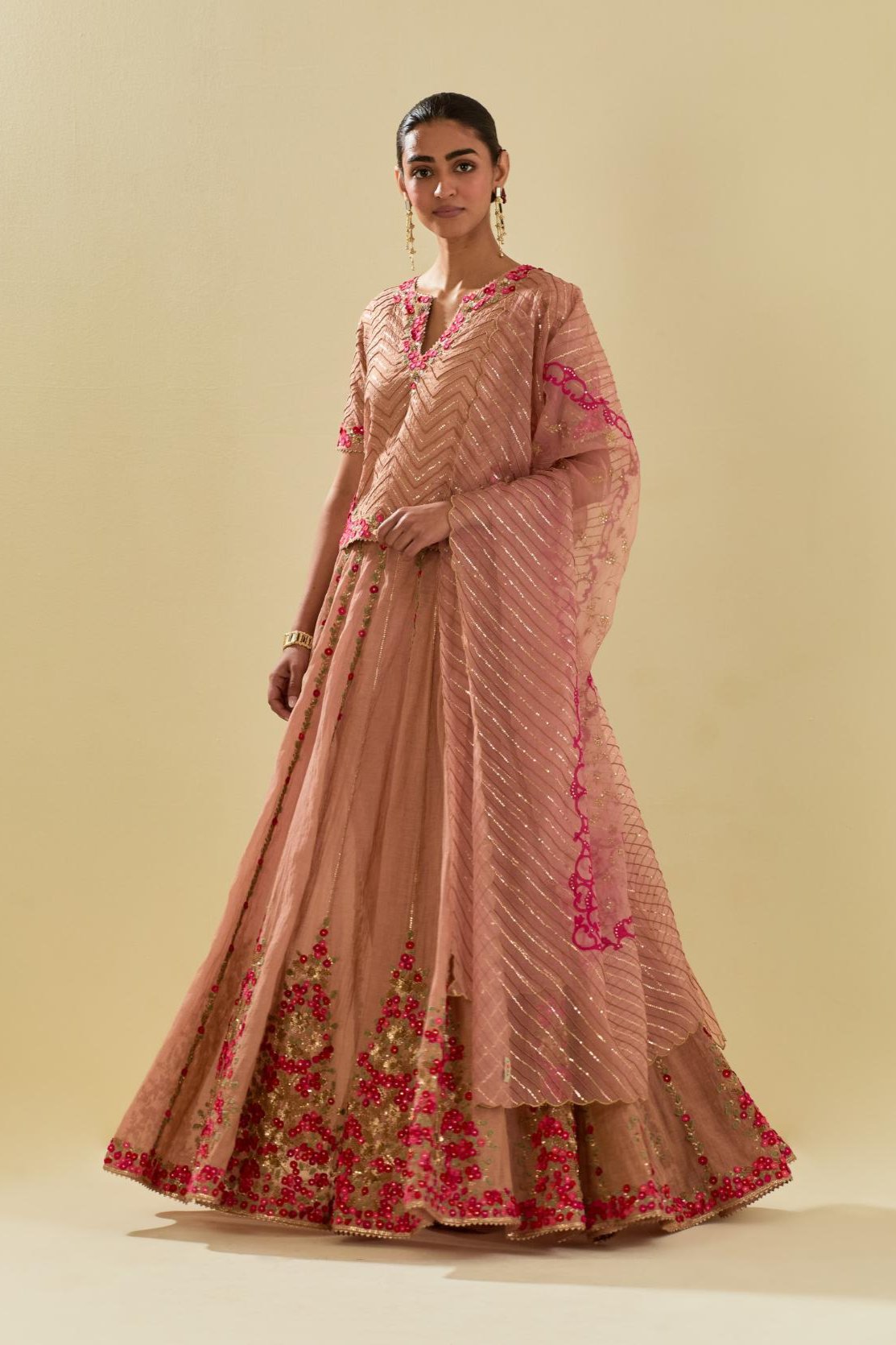 Pink tissue chanderi short top set with delicate hand cut silk flower embroidery, highlighted with gold sequins and beads.