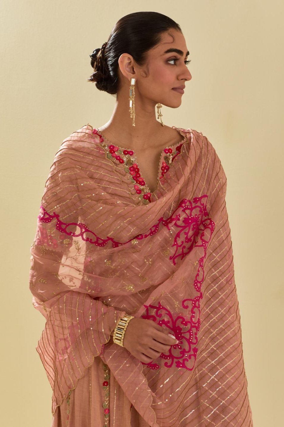 Pink silk organza dupatta with delicate gold zari embroidery & silk applique work, highlighted with gold sequins and beads.