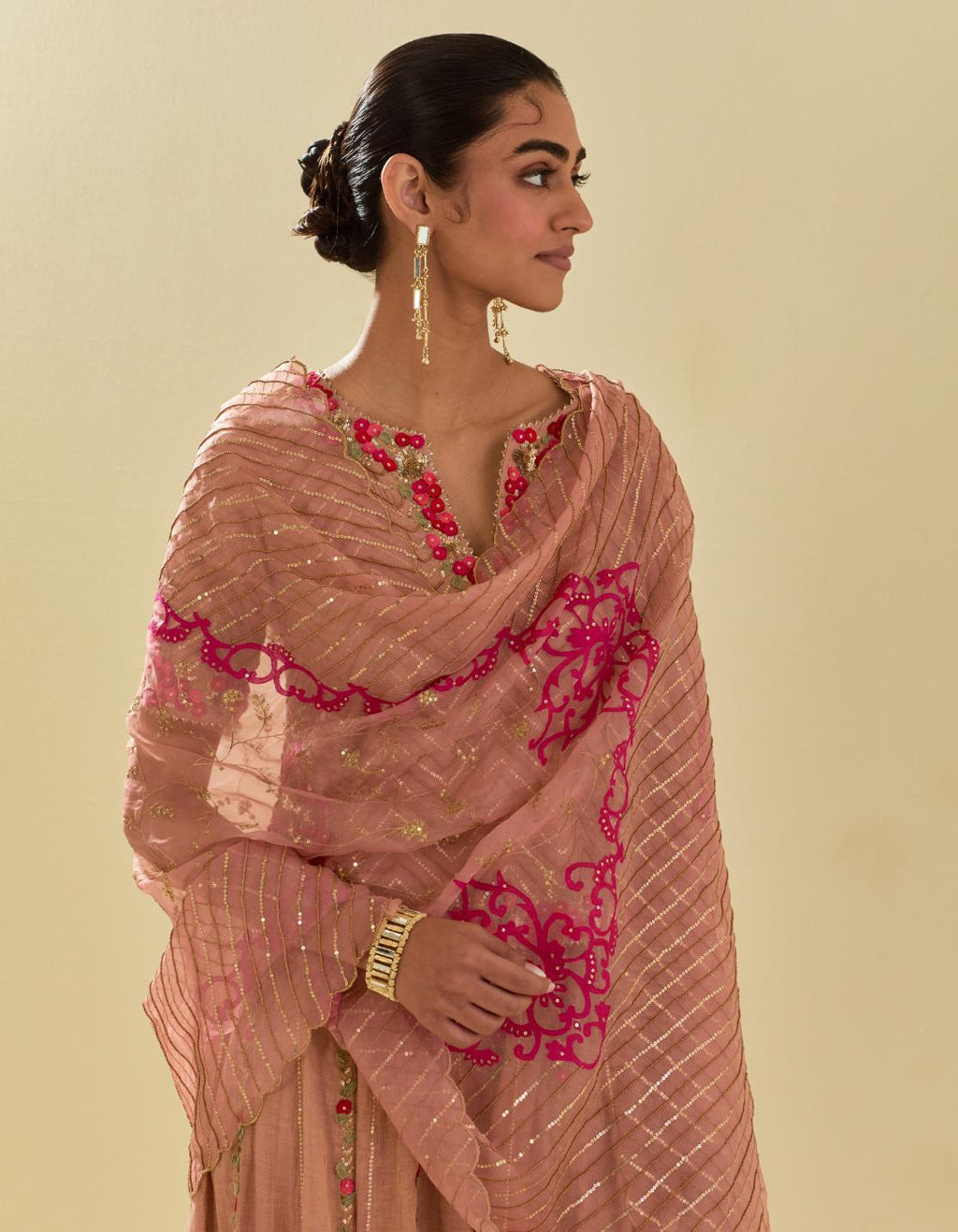Pink silk organza dupatta with delicate gold zari embroidery & silk applique work, highlighted with gold sequins and beads.