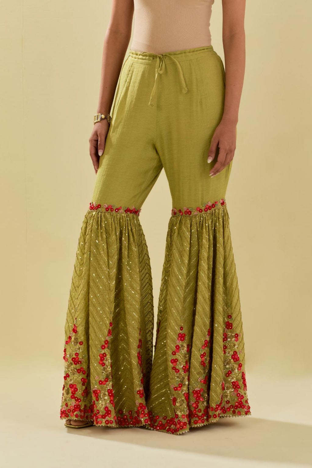Green tissue chanderi farshi with delicate hand cut silk flower embroidery, highlighted with gold sequins and beads.