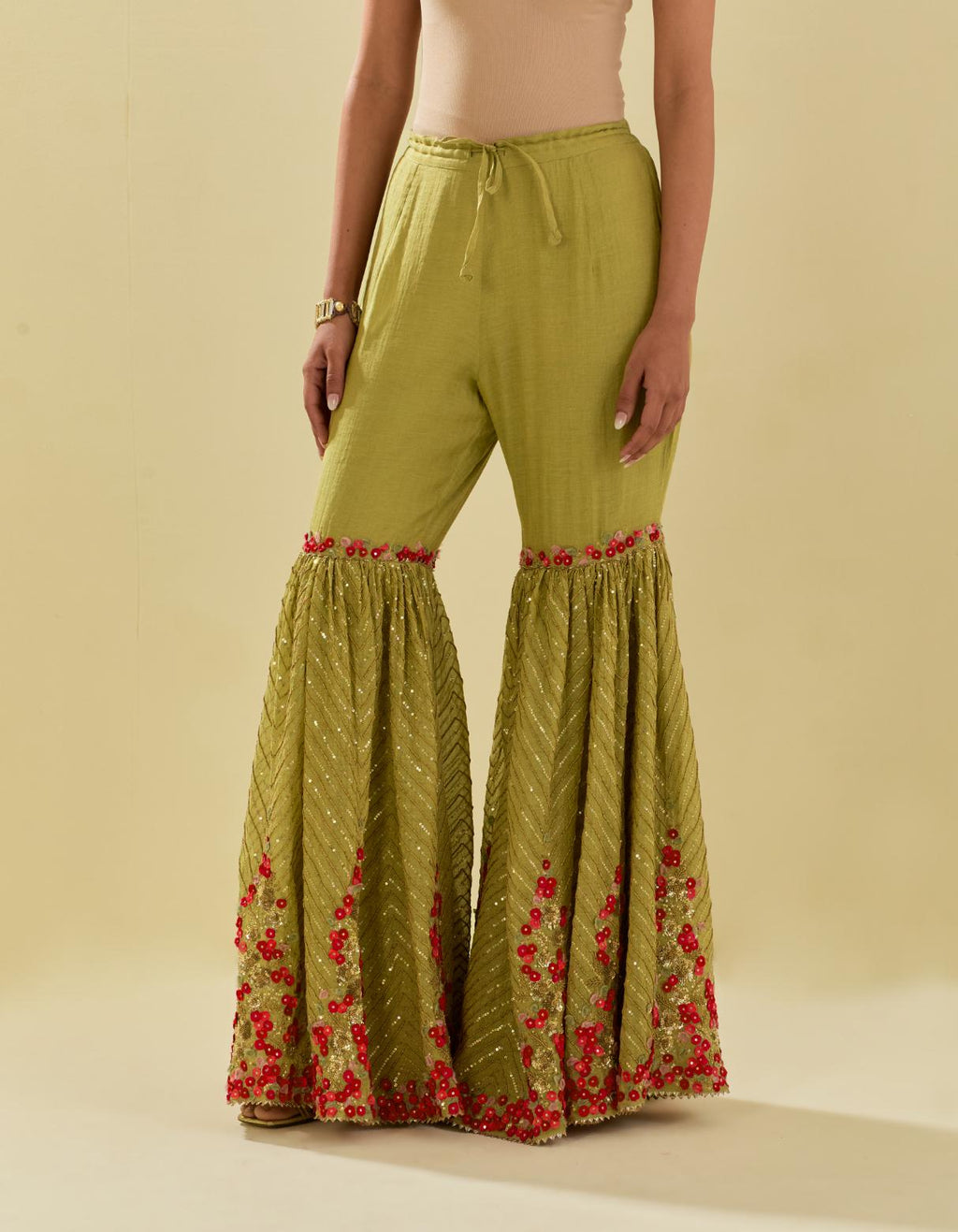 Green tissue chanderi farshi with delicate hand cut silk flower embroidery, highlighted with gold sequins and beads.