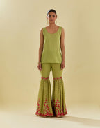 Green tissue chanderi short kurta set with round neck and slit in the front and all-over hand cut silk flower embroidery.
