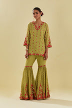 Green tissue chanderi short kurta set with round neck and slit in the front and all-over hand cut silk flower embroidery.
