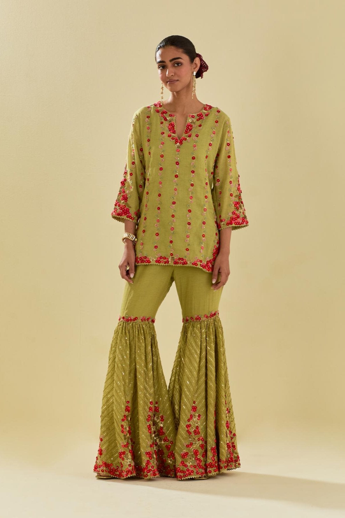 Green tissue chanderi short kurta set with round neck and slit in the front and all-over hand cut silk flower embroidery.