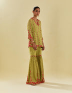 Green tissue chanderi short kurta set with round neck and slit in the front and all-over hand cut silk flower embroidery.