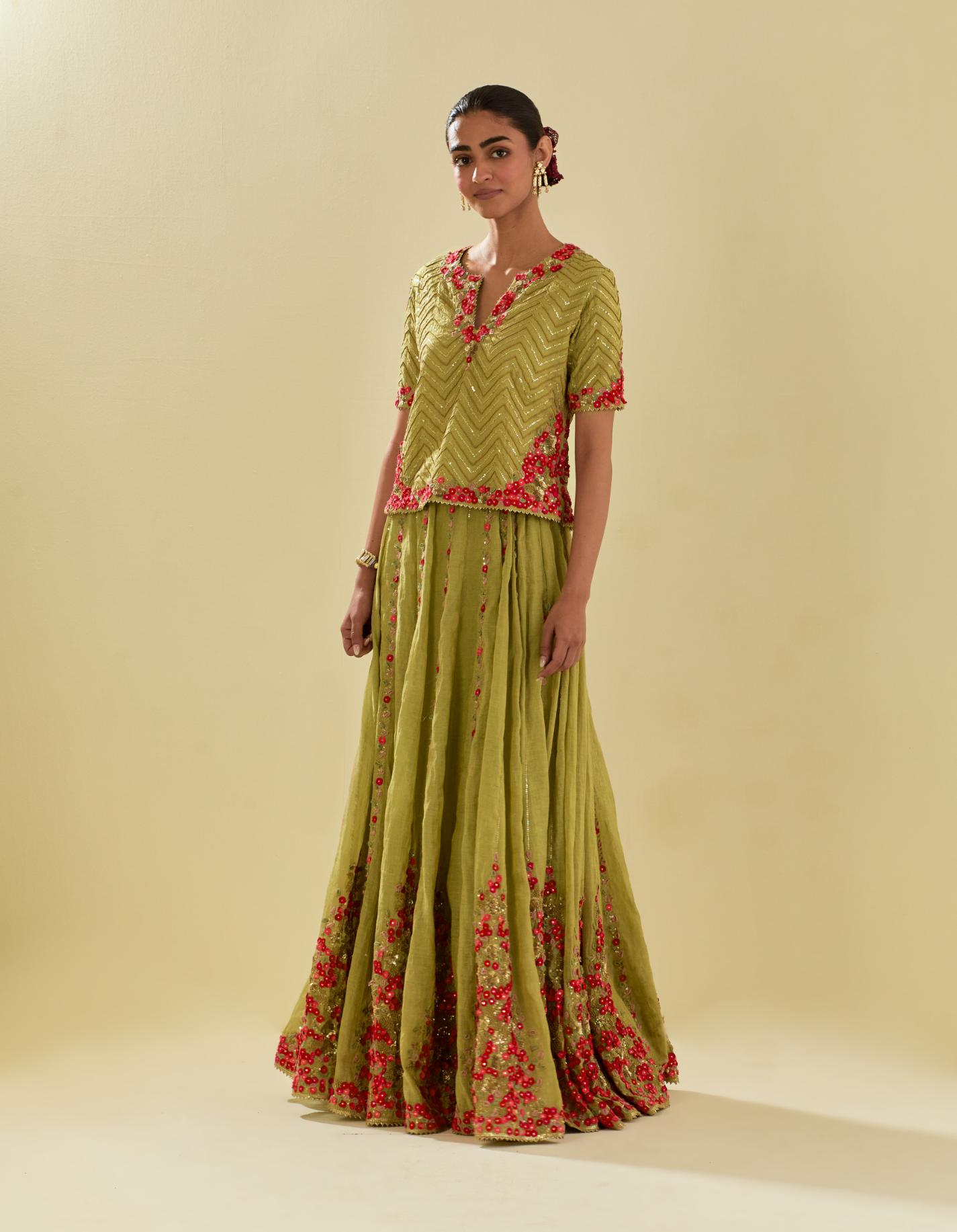 Green tissue chanderi short top set with delicate hand cut silk flower embroidery, highlighted with gold sequins and beads.